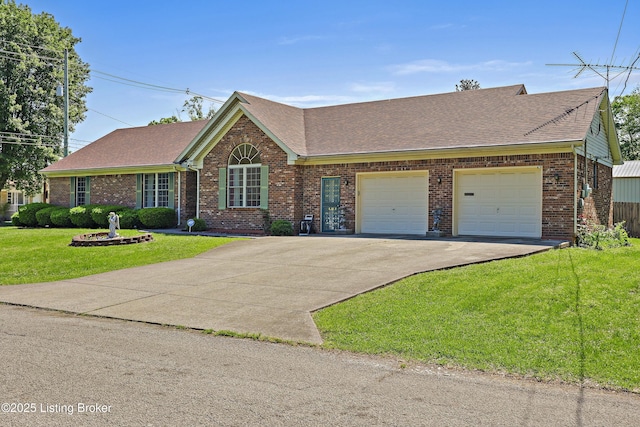 7601 Greenfield Ave, Louisville, KY 40214 - view of front of house with brick siding, a garage, driveway, roof with shingles, and a front yard