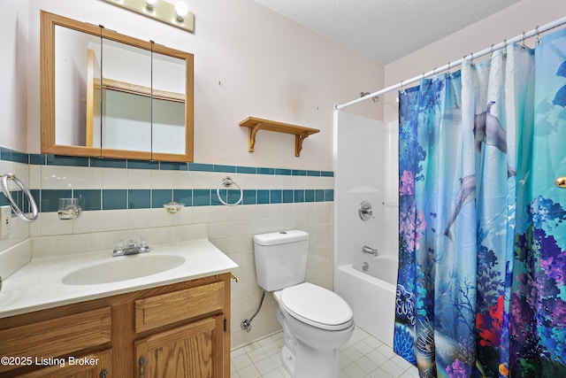 7601 Greenfield Ave, Louisville, KY 40214 - full bathroom featuring tile patterned floors, a wainscoted wall, shower / bath combination with curtain, tile walls, and vanity