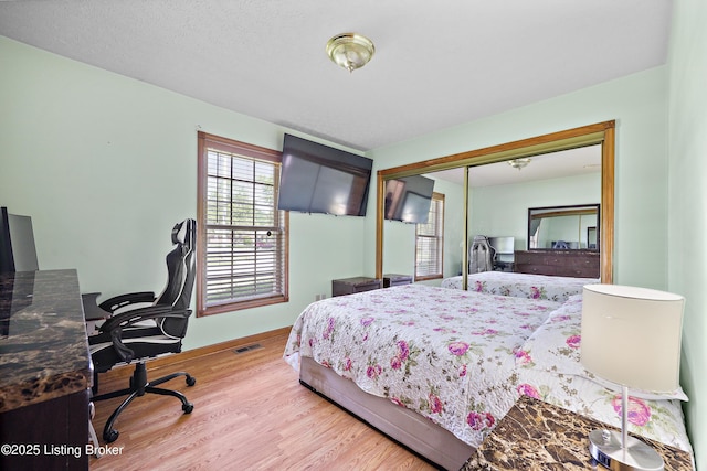 7601 Greenfield Ave, Louisville, KY 40214 - bedroom with wood finished floors, a closet, and a desk