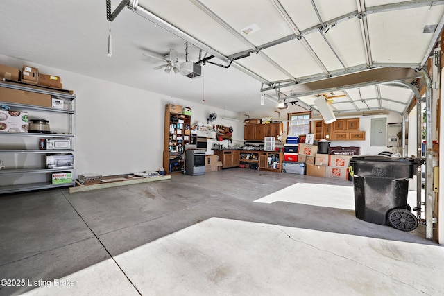 7601 Greenfield Ave, Louisville, KY 40214 - garage with a garage door opener and electric panel