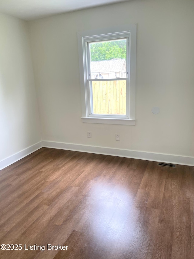 3004 Wayne Rd, Louisville, KY 40216 - spare room featuring dark wood finished floors and baseboards