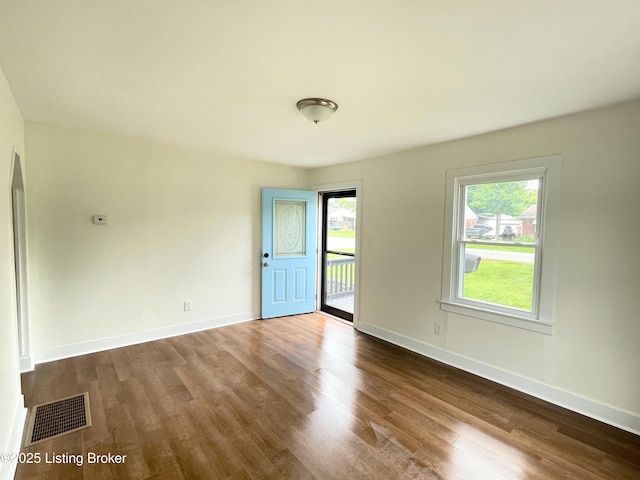 3004 Wayne Rd, Louisville, KY 40216 - empty room with dark wood-style floors and baseboards