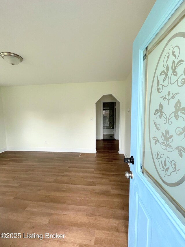 3004 Wayne Rd, Louisville, KY 40216 - foyer featuring wood finished floors, baseboards, and arched walkways