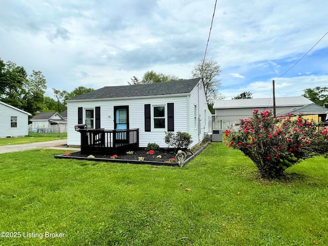 3004 Wayne Rd, Louisville, KY 40216 - view of front of home with central air condition unit, a front lawn, and roof with shingles