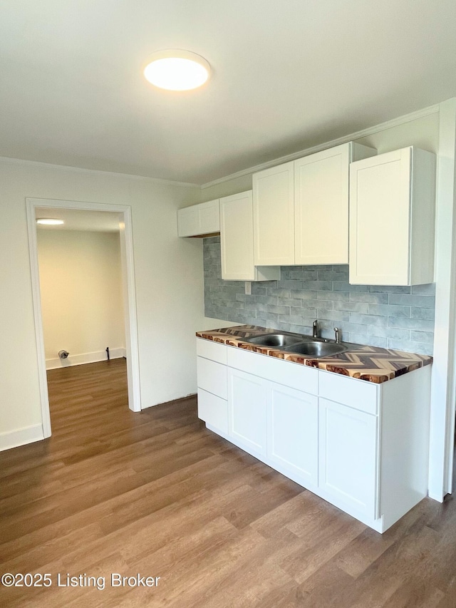 3004 Wayne Rd, Louisville, KY 40216 - kitchen featuring a sink, white cabinetry, decorative backsplash, and light wood finished floors