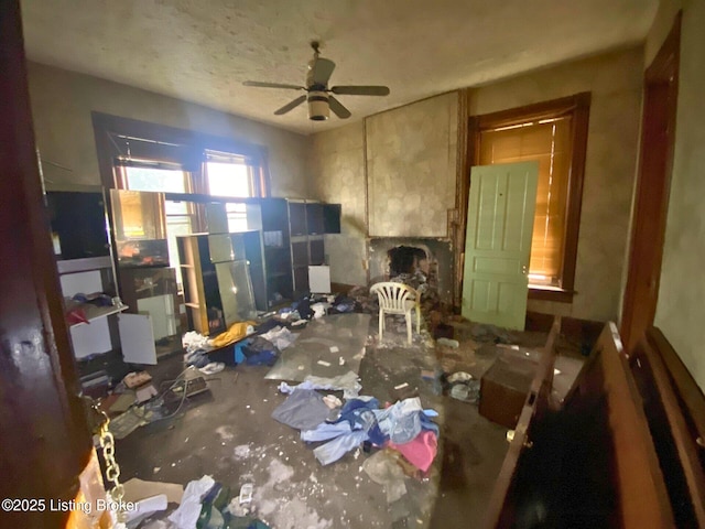 1014 S Brook St, Louisville, KY 40203 - living room with ceiling fan and a stone fireplace