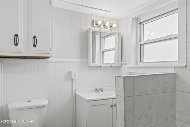 207 Ottawa Ave, Louisville, KY 40214 - half bath featuring toilet, vanity, and a wainscoted wall