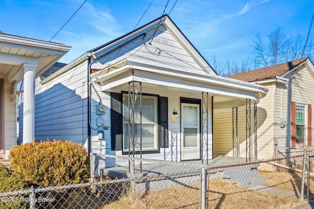 207 Ottawa Ave, Louisville, KY 40214 - shotgun-style home with covered porch and a fenced front yard