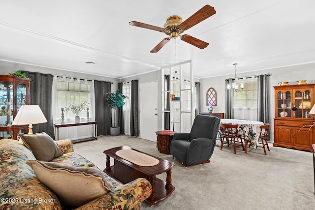 200 Derby Ave, Louisville, KY 40218 - carpeted living room with plenty of natural light, a chandelier, ceiling fan, and crown molding