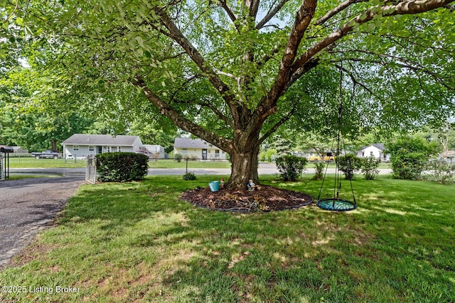 200 Derby Ave, Louisville, KY 40218 - view of green lawn featuring asphalt driveway