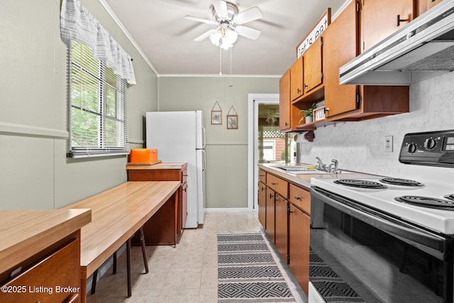 200 Derby Ave, Louisville, KY 40218 - kitchen featuring range with electric stovetop, under cabinet range hood, freestanding refrigerator, brown cabinetry, and ornamental molding