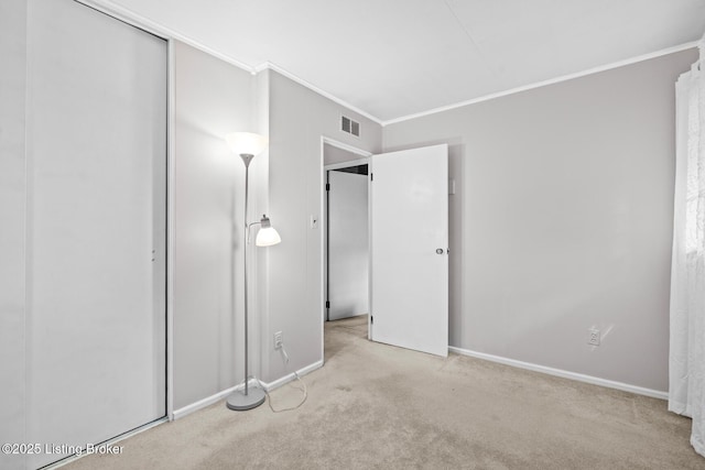 200 Derby Ave, Louisville, KY 40218 - unfurnished bedroom featuring carpet flooring, crown molding, baseboards, and a closet