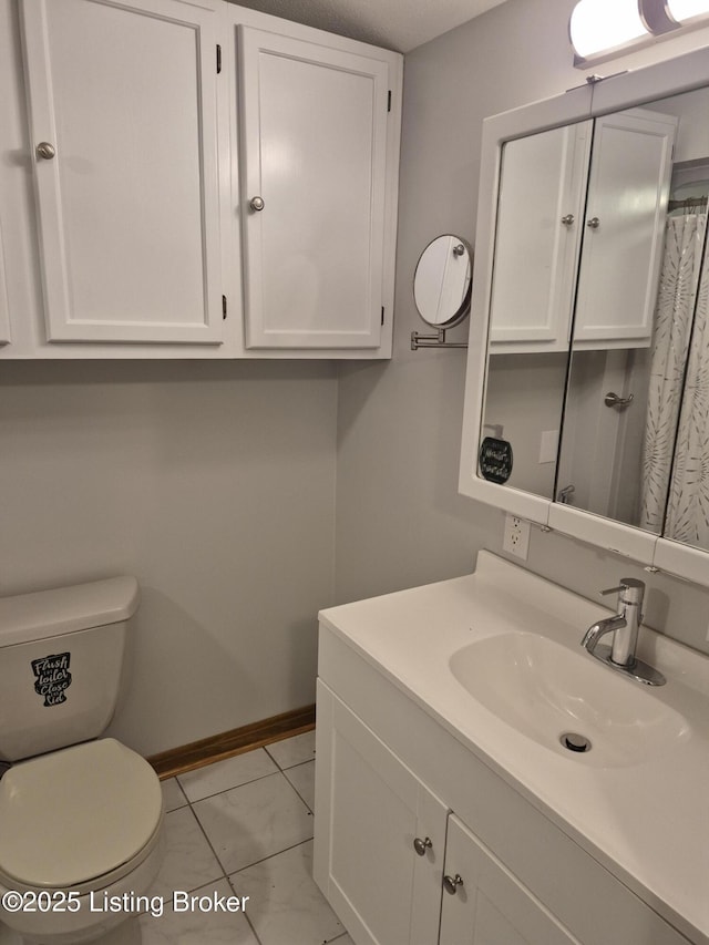 810 Packard Ave, Louisville, KY 40217 - bathroom featuring vanity, toilet, and baseboards