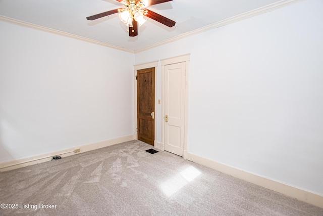 919 Eastern Pkwy, Louisville, KY 40217 - spare room featuring ornamental molding, a ceiling fan, carpet, and baseboards