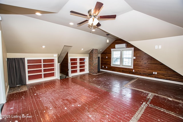919 Eastern Pkwy, Louisville, KY 40217 - bonus room with hardwood / wood-style flooring, ceiling fan, wooden walls, lofted ceiling, and built in features