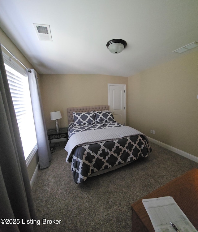 bedroom featuring carpet floors and baseboards