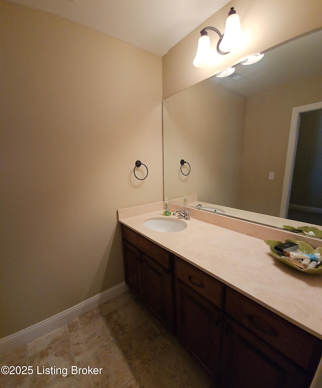 bathroom featuring vanity and baseboards