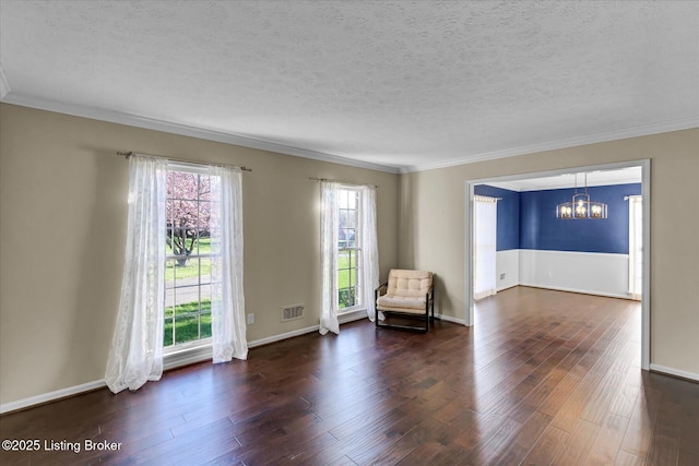 7208 Iron Gate Ct, Louisville, KY 40241 - sitting room with a chandelier, a textured ceiling, crown molding, plenty of natural light, and dark wood-style floors