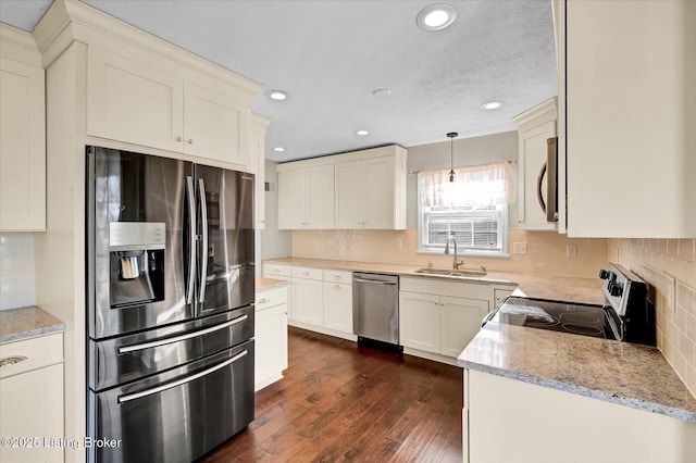 7208 Iron Gate Ct, Louisville, KY 40241 - kitchen featuring stainless steel appliances, a sink, recessed lighting, tasteful backsplash, and light stone counters