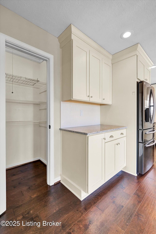 7208 Iron Gate Ct, Louisville, KY 40241 - kitchen with stainless steel fridge with ice dispenser, dark wood finished floors, recessed lighting, a textured ceiling, and light stone counters