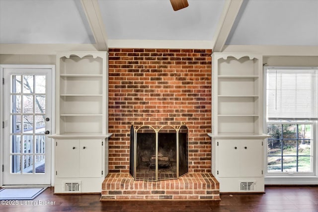 7208 Iron Gate Ct, Louisville, KY 40241 - unfurnished living room with beamed ceiling, a brick fireplace, dark wood-style flooring, and a ceiling fan