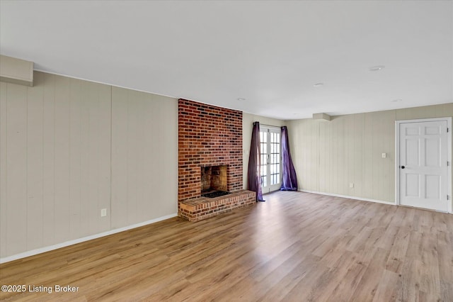 7208 Iron Gate Ct, Louisville, KY 40241 - unfurnished living room featuring wood finished floors, baseboards, a fireplace, and wood walls