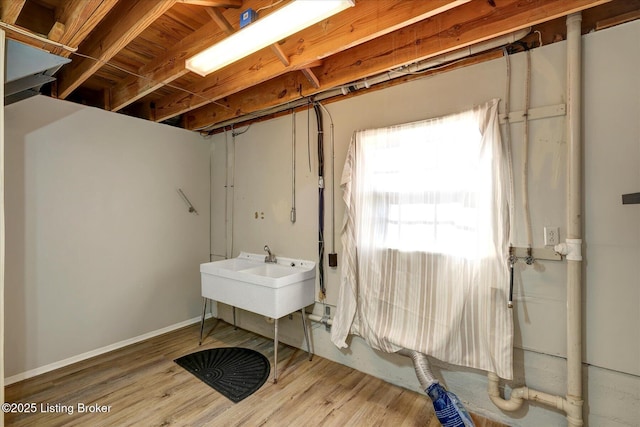 7208 Iron Gate Ct, Louisville, KY 40241 - below grade area with a sink, wood finished floors, and baseboards