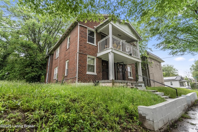 1724 W Ormsby Ave, Louisville, KY 40210 - view of front facade with a balcony and brick siding