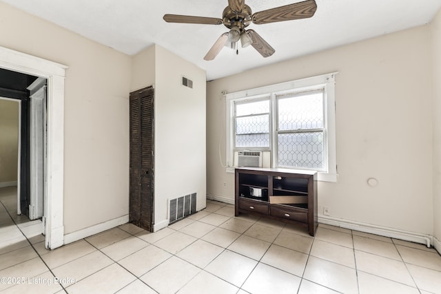 1724 W Ormsby Ave, Louisville, KY 40210 - unfurnished room with light tile patterned flooring, baseboards, ceiling fan, and cooling unit