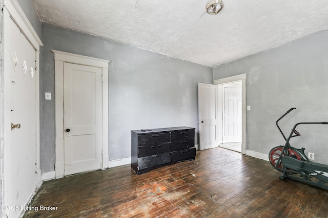 1724 W Ormsby Ave, Louisville, KY 40210 - interior space featuring hardwood / wood-style floors, a textured ceiling, and baseboards