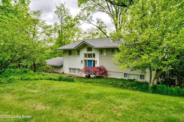 9113 Darley Dr, Louisville, KY 40241 - view of front of home with brick siding, roof with shingles, and a front yard