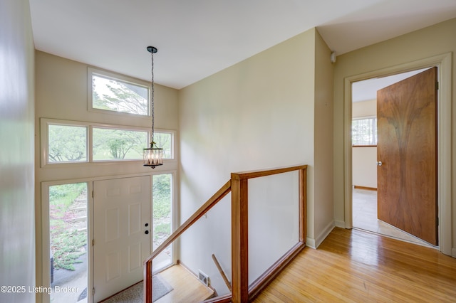 9113 Darley Dr, Louisville, KY 40241 - entryway with a chandelier, light wood finished floors, healthy amount of natural light, and a high ceiling