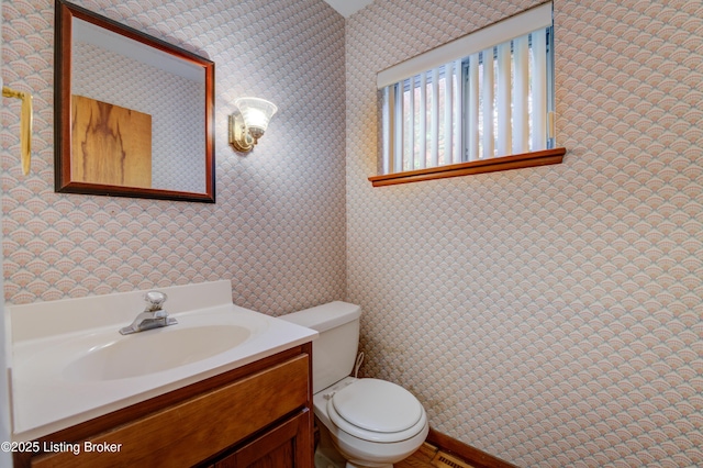 9113 Darley Dr, Louisville, KY 40241 - bathroom with toilet, vanity, and wallpapered walls