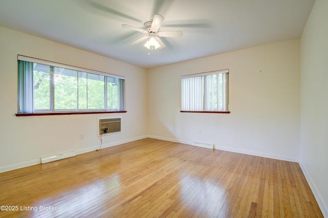 9113 Darley Dr, Louisville, KY 40241 - spare room featuring light wood-type flooring, ceiling fan, baseboards, and baseboard heating