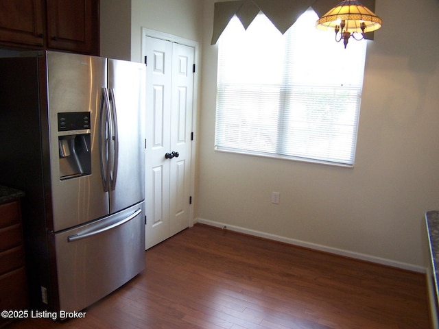 1411 Amberlin Ln, Louisville, KY 40245 - kitchen with stainless steel fridge, wood finished floors, baseboards, and dark countertops