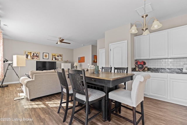 11888 Trottingham Cir, Louisville, KY 40299 - dining space with wood finished floors, ceiling fan, and baseboards