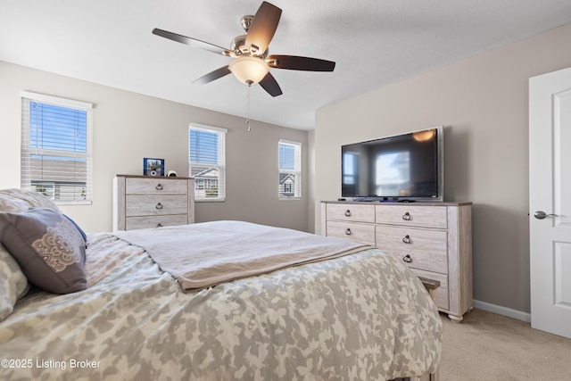 11888 Trottingham Cir, Louisville, KY 40299 - bedroom featuring light colored carpet, multiple windows, baseboards, and ceiling fan