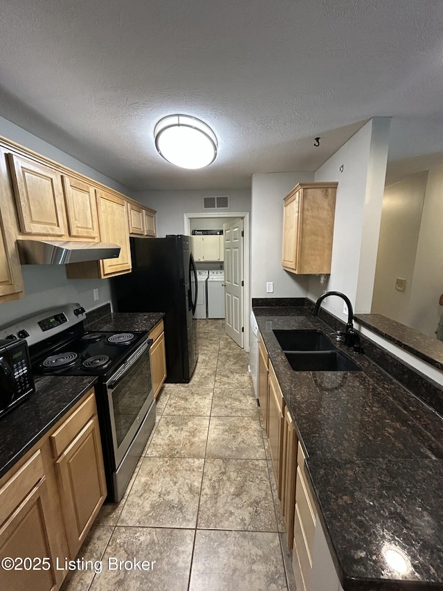 8411 Ambrosse Ln Unit 104, Louisville, KY 40299 - kitchen with black appliances, washer and clothes dryer, a sink, a textured ceiling, and dark stone counters