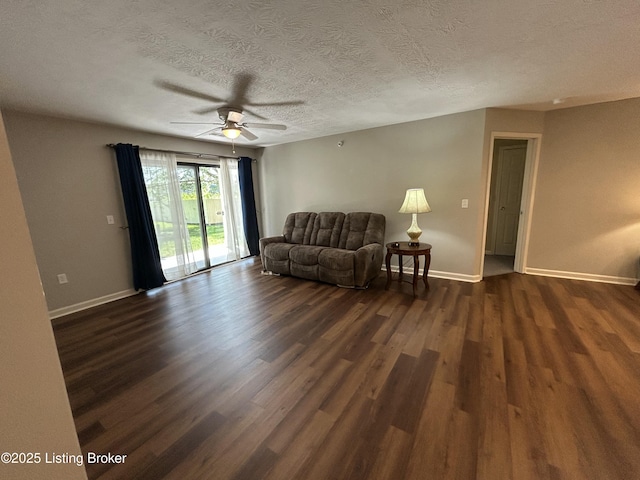 8411 Ambrosse Ln Unit 104, Louisville, KY 40299 - living room with dark wood-style flooring, a ceiling fan, baseboards, and a textured ceiling