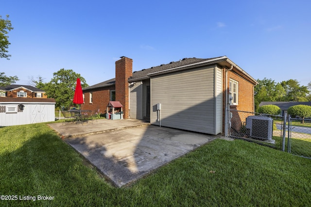 12100 Edenwood Dr, Louisville, KY 40243 - back of property with central AC, a patio area, an outbuilding, and a storage shed