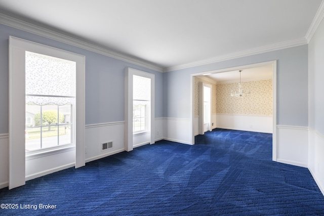 12100 Edenwood Dr, Louisville, KY 40243 - spare room with healthy amount of natural light, a chandelier, dark carpet, crown molding, and a wainscoted wall