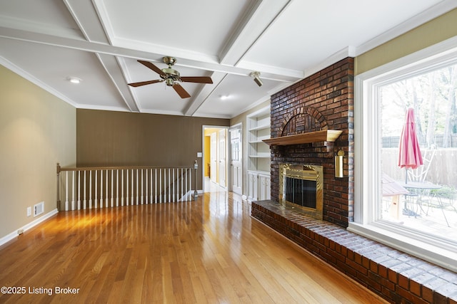12100 Edenwood Dr, Louisville, KY 40243 - unfurnished living room featuring plenty of natural light, wood-type flooring, ceiling fan, and beamed ceiling