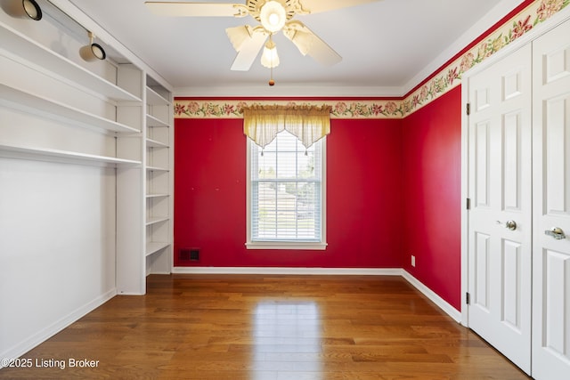 12100 Edenwood Dr, Louisville, KY 40243 - unfurnished bedroom with wood finished floors, a closet, baseboards, and ceiling fan
