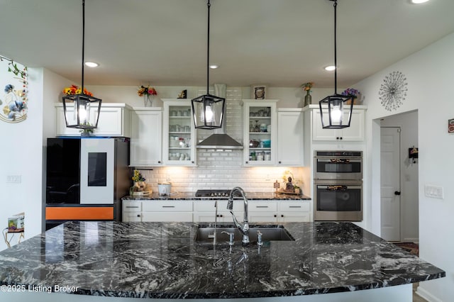 15803 Stonehouse Ct, Louisville, KY 40245 - kitchen featuring double oven, tasteful backsplash, a large island, refrigerator, and white cabinets