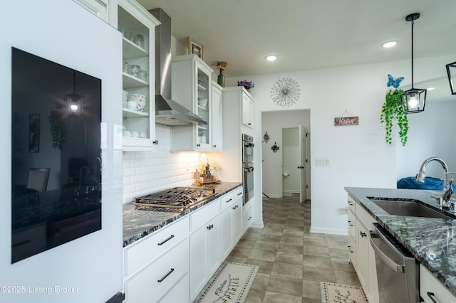 15803 Stonehouse Ct, Louisville, KY 40245 - kitchen featuring appliances with stainless steel finishes, wall chimney exhaust hood, backsplash, dark stone countertops, and recessed lighting