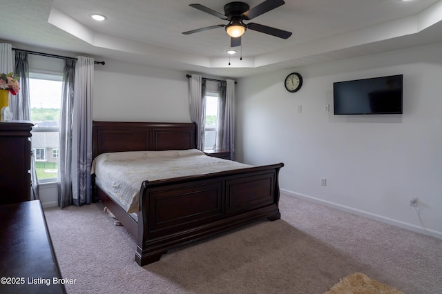 15803 Stonehouse Ct, Louisville, KY 40245 - bedroom with a tray ceiling, light carpet, ceiling fan, and recessed lighting