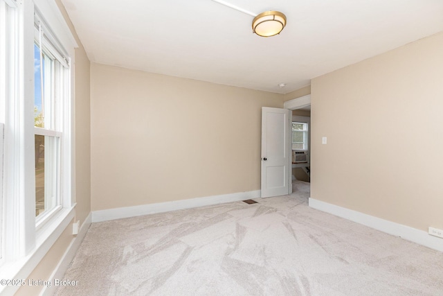 835 Sylvia St, Louisville, KY 40217 - unfurnished room with light carpet, baseboards, and cooling unit