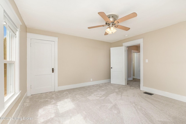 835 Sylvia St, Louisville, KY 40217 - empty room with light carpet, baseboards, and ceiling fan
