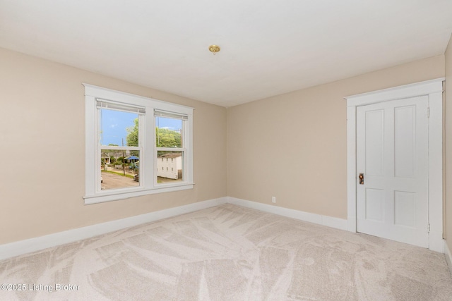 835 Sylvia St, Louisville, KY 40217 - empty room featuring carpet floors and baseboards