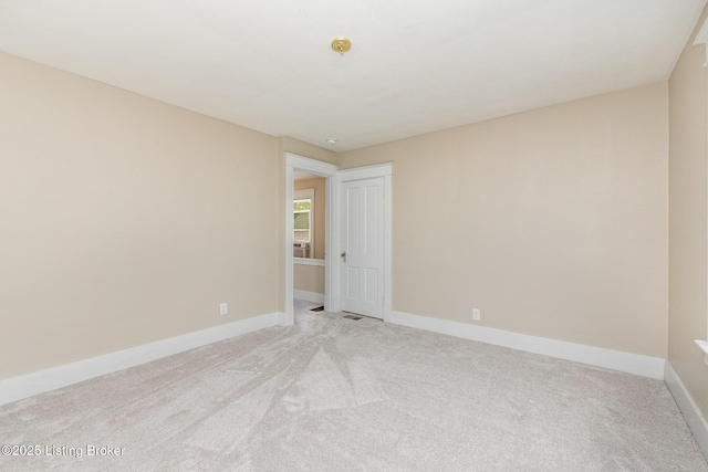 835 Sylvia St, Louisville, KY 40217 - empty room with light carpet and baseboards